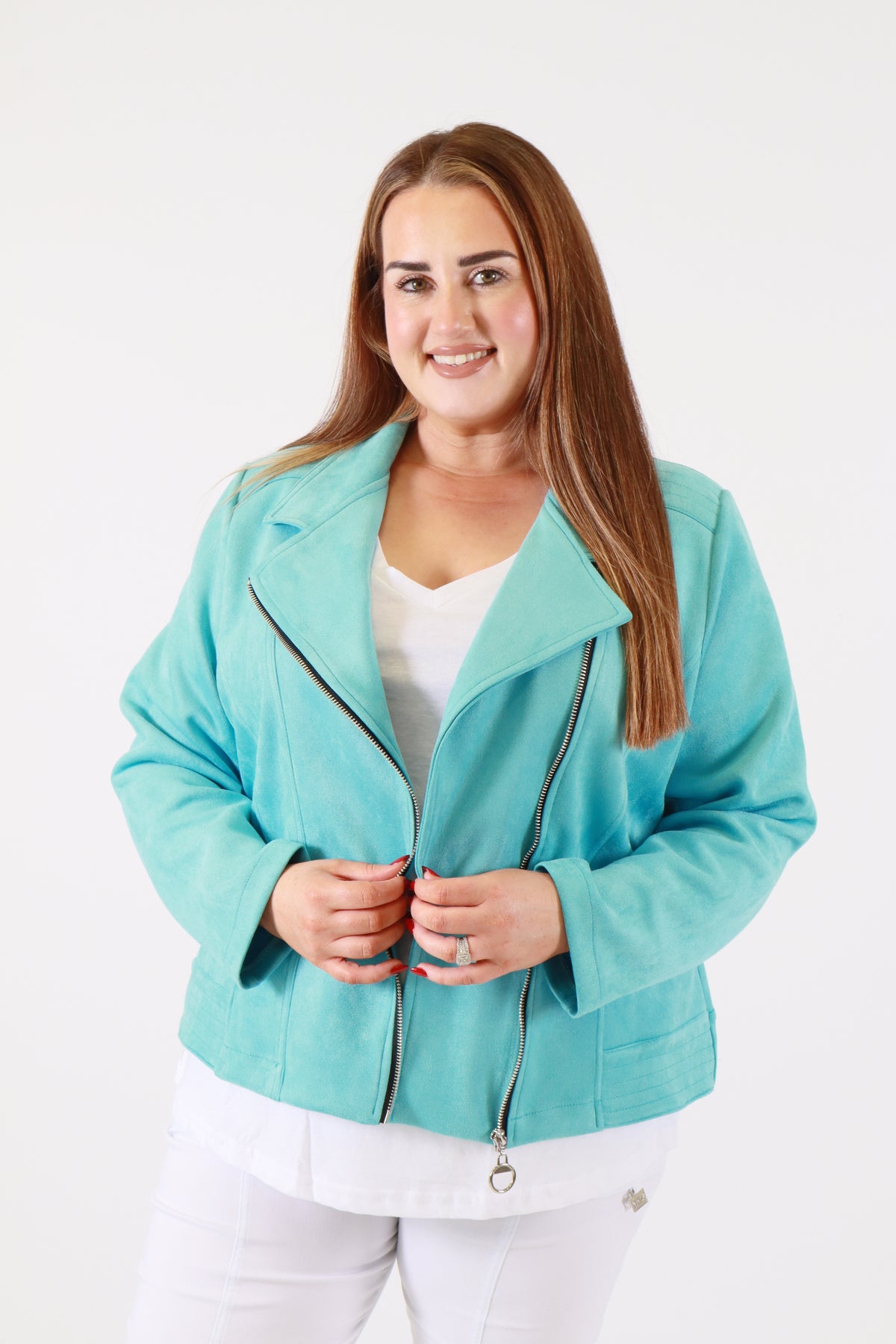 Woman wearing a turquoise jacket on a white background