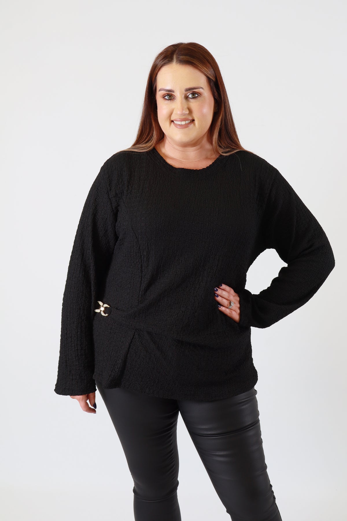 Person wearing a black outfit on a white background