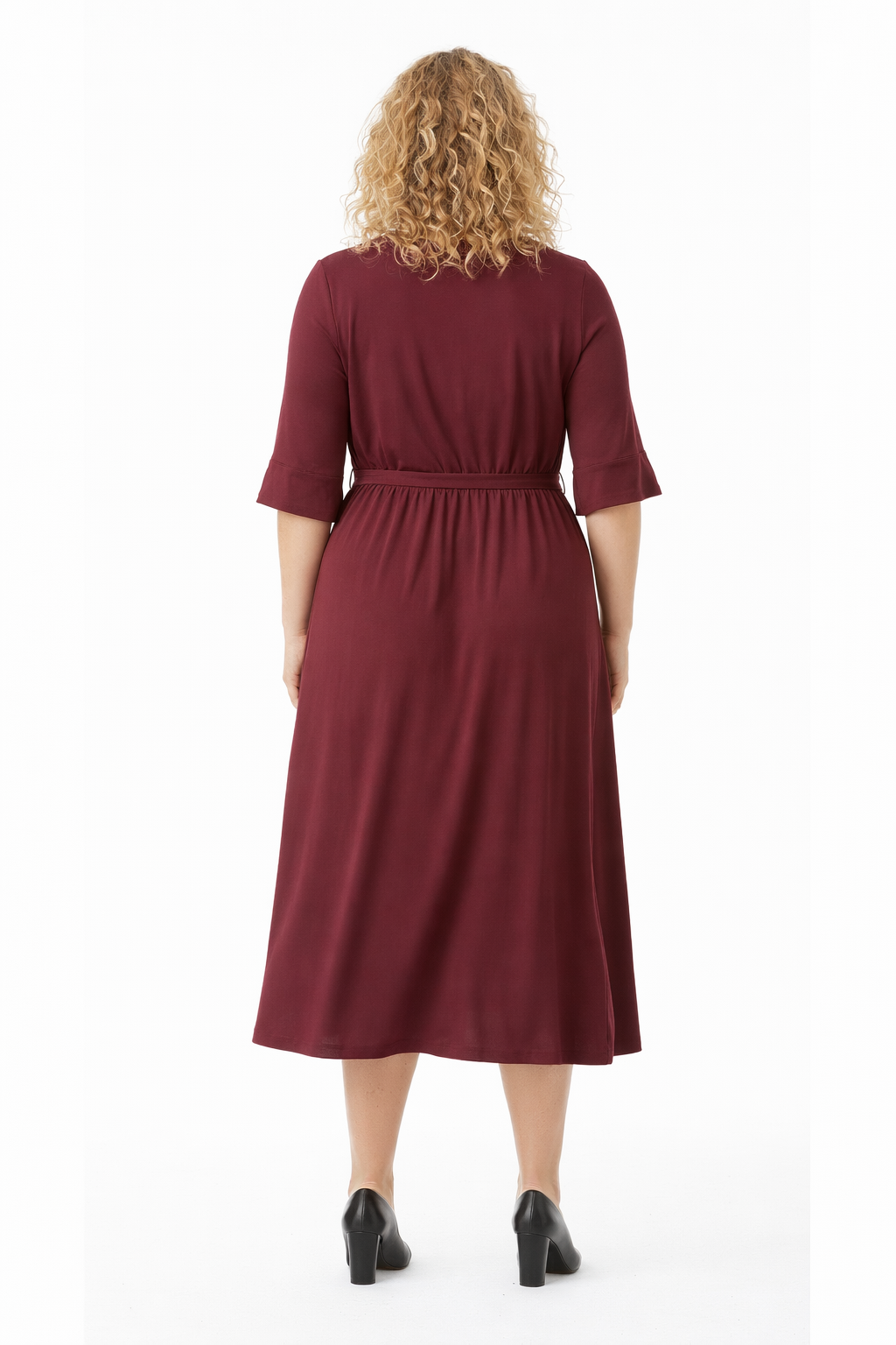 Woman wearing a burgundy dress on a white background