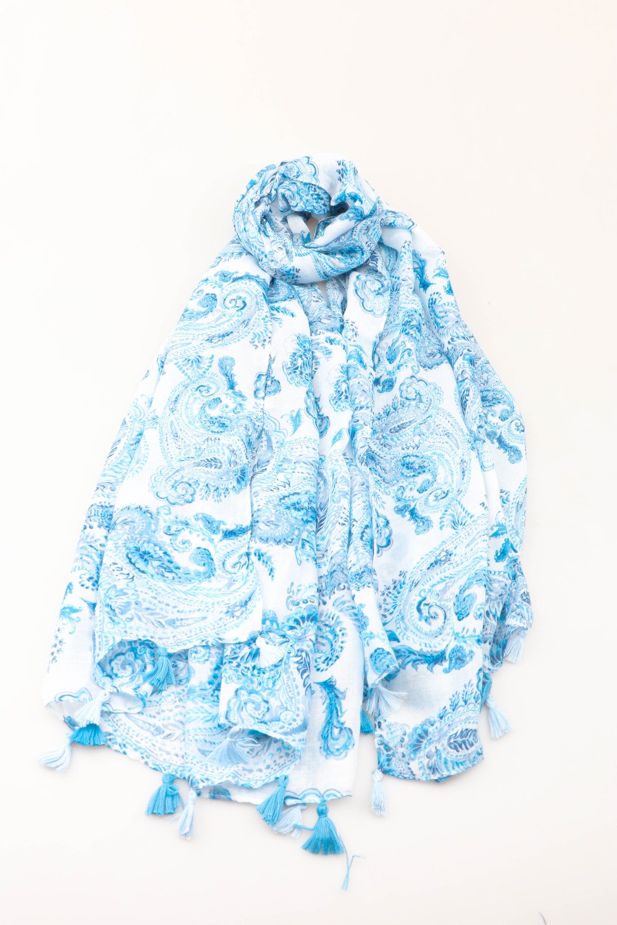 Blue and white paisley print scarf on a white background