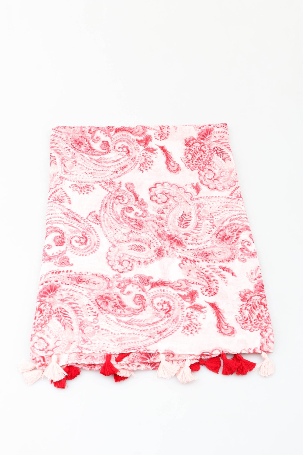 Red and white paisley printed scarf on a white background