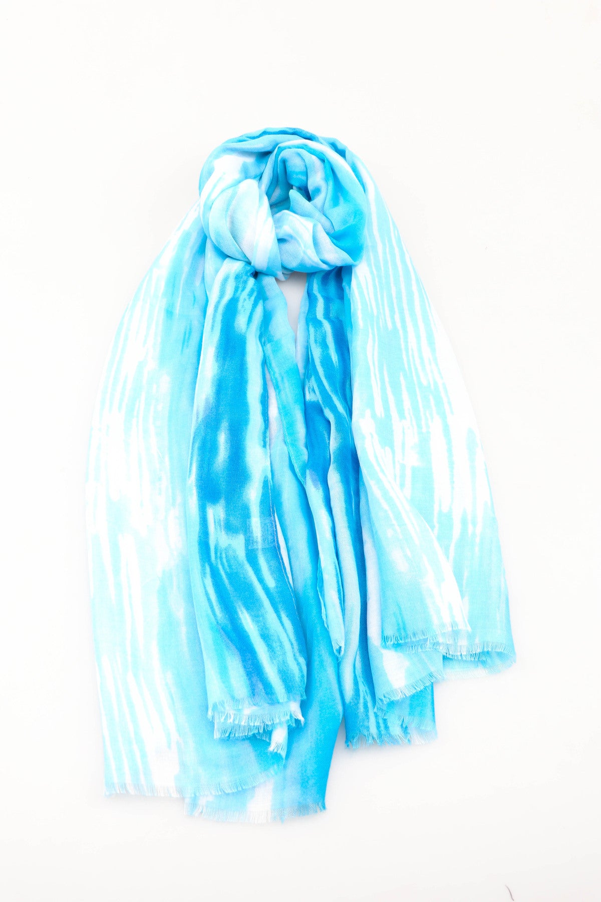 Blue and white tie-dye scarf on a white background