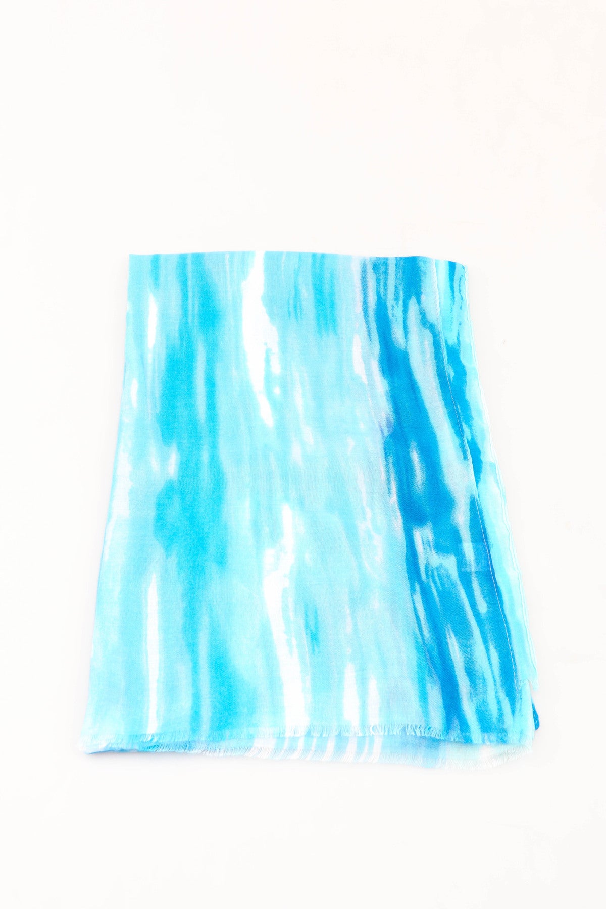 Blue and white tie-dye pattern scarf on a white background
