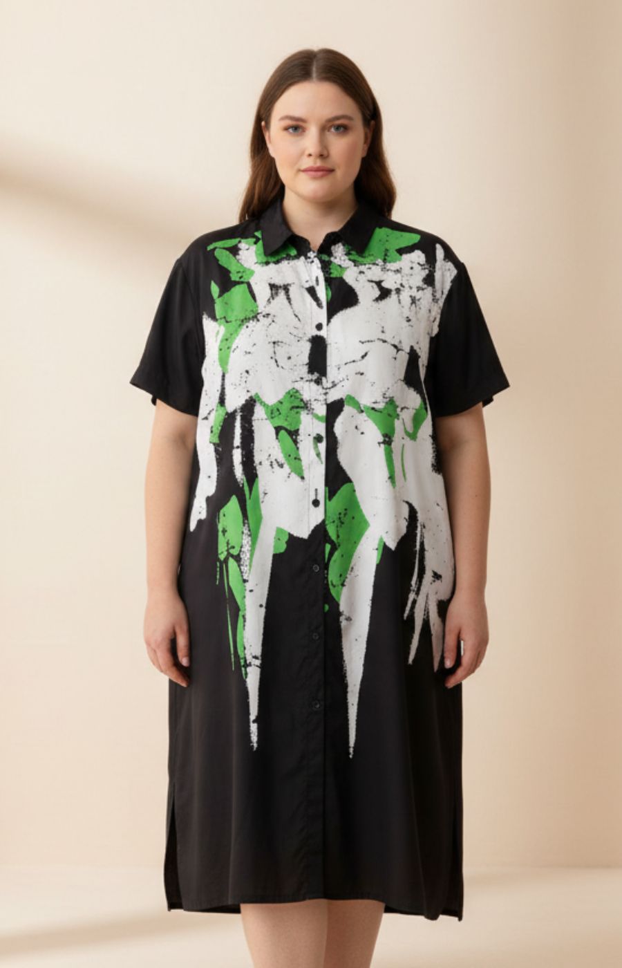 Gwen Dress in Black, A shirt dress with a button up front, round neckline with shirt collar, short sleeves and an A-line shape. Funky White and Green painted design on the front