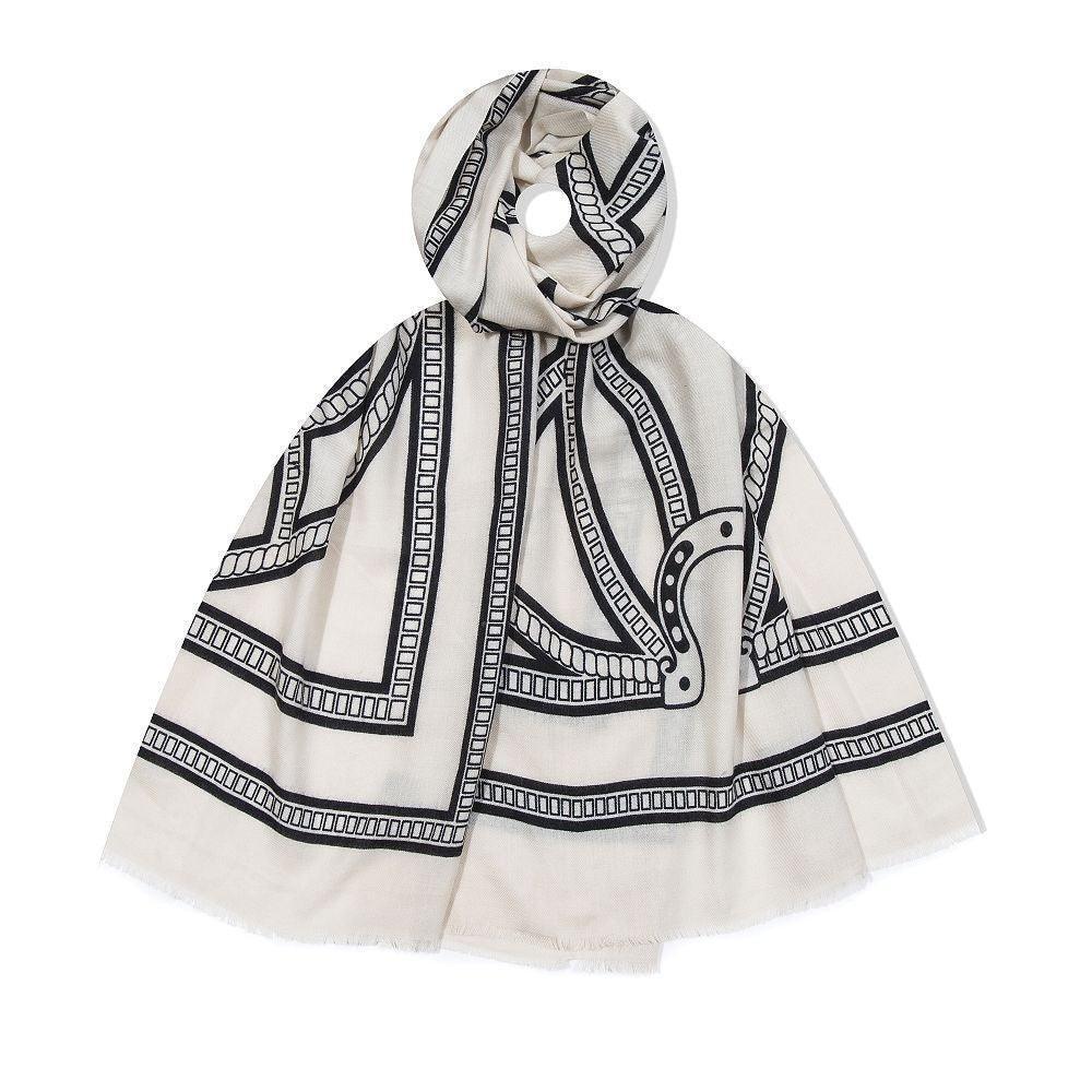 White scarf with black geometric pattern on a white background