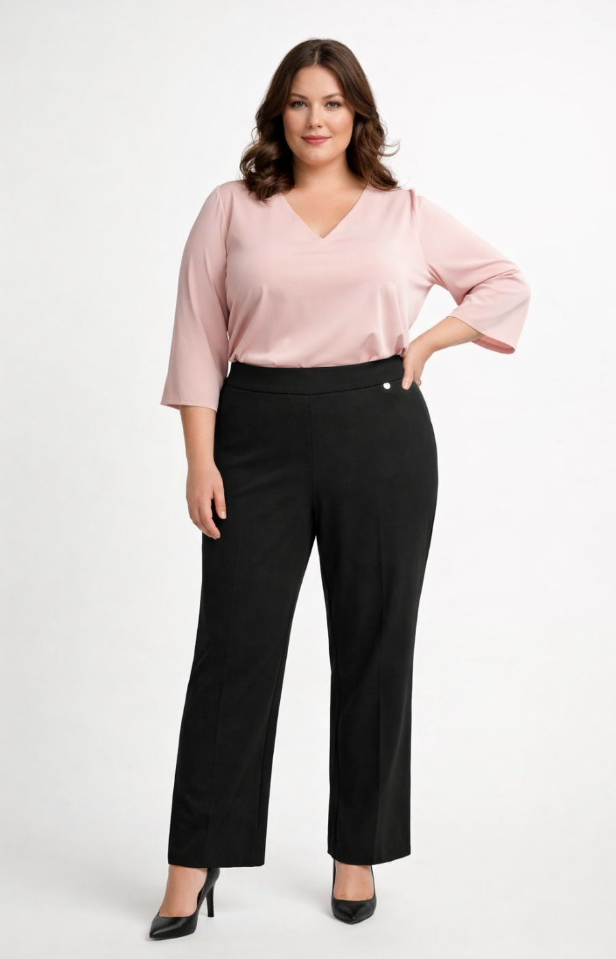 Woman wearing a pink blouse and black trousers on a white background