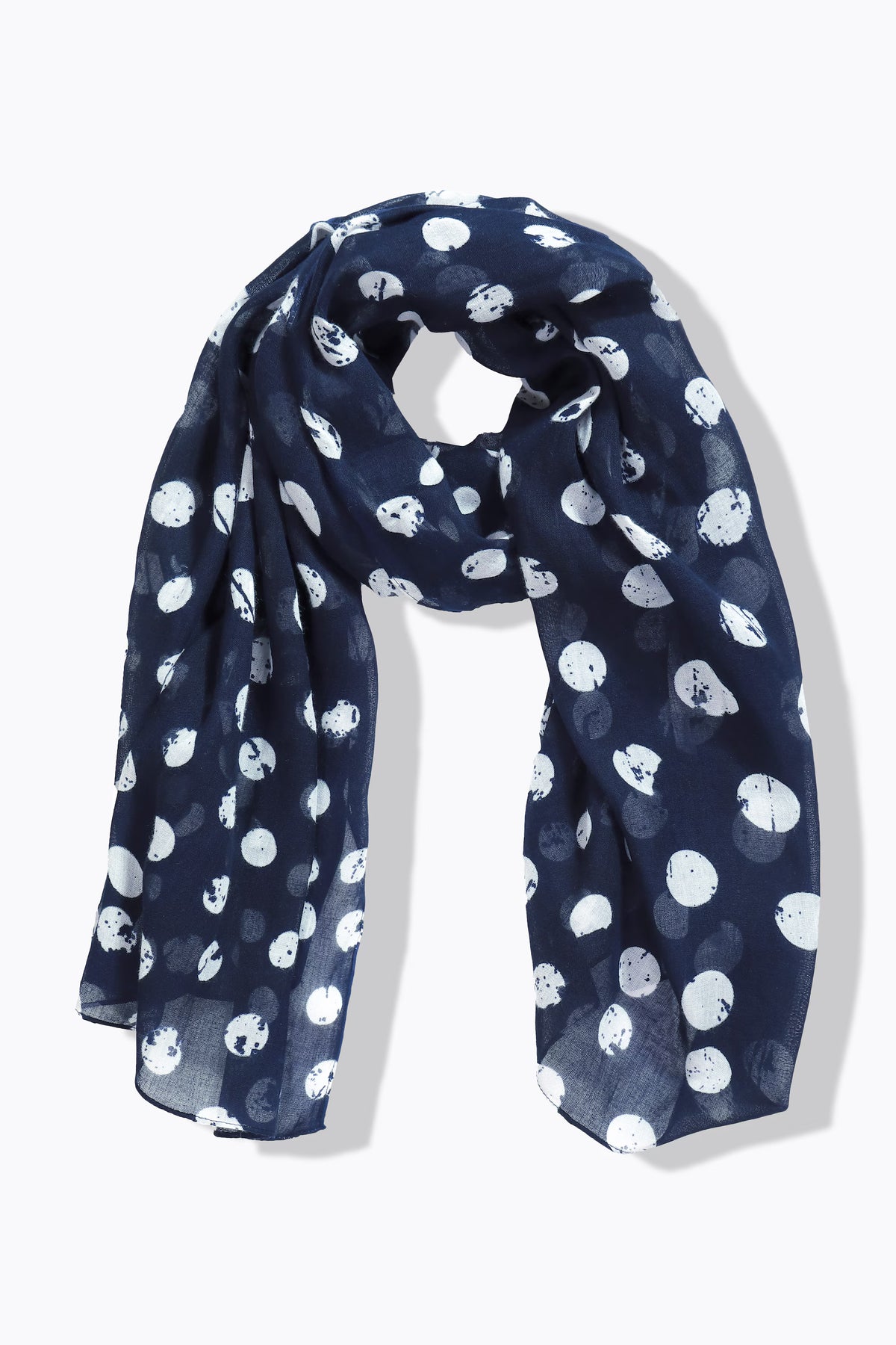 Navy blue scarf with white dot pattern on a white background