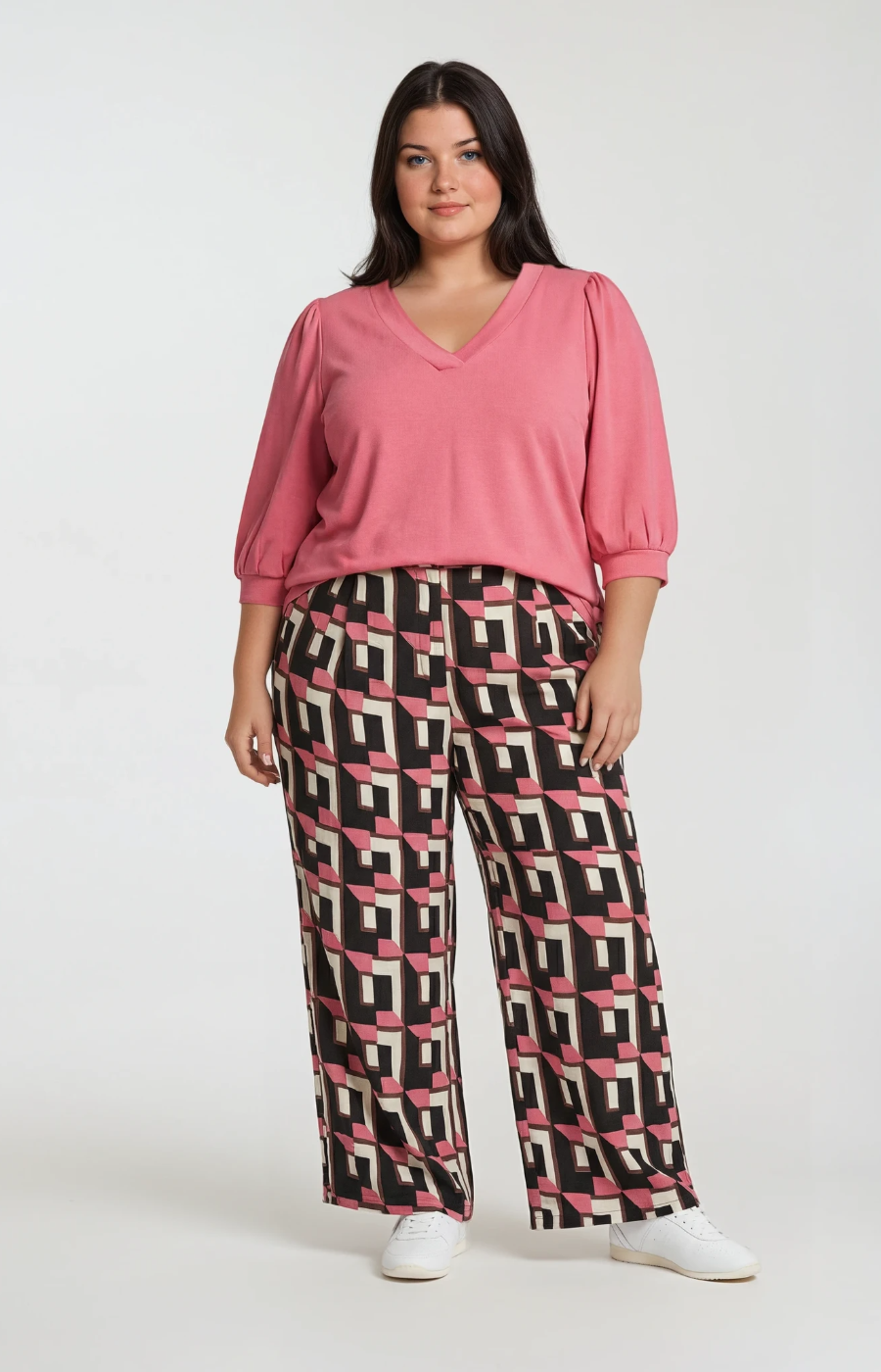 Wasabi Sarena Trousers in Pink, a wide leg trouser with button closure, side pockets and an all over geometric print