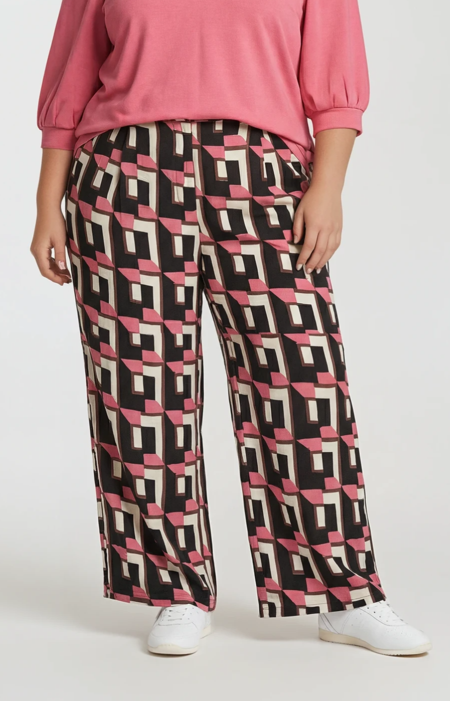Wasabi Sarena Trousers in Pink, a wide leg trouser with button closure, side pockets and an all over geometric print