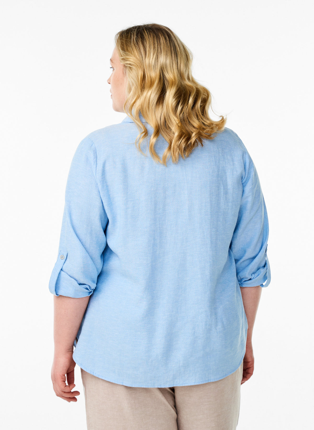 Woman wearing the Zizzi Lina Shirt in Blue on a white background