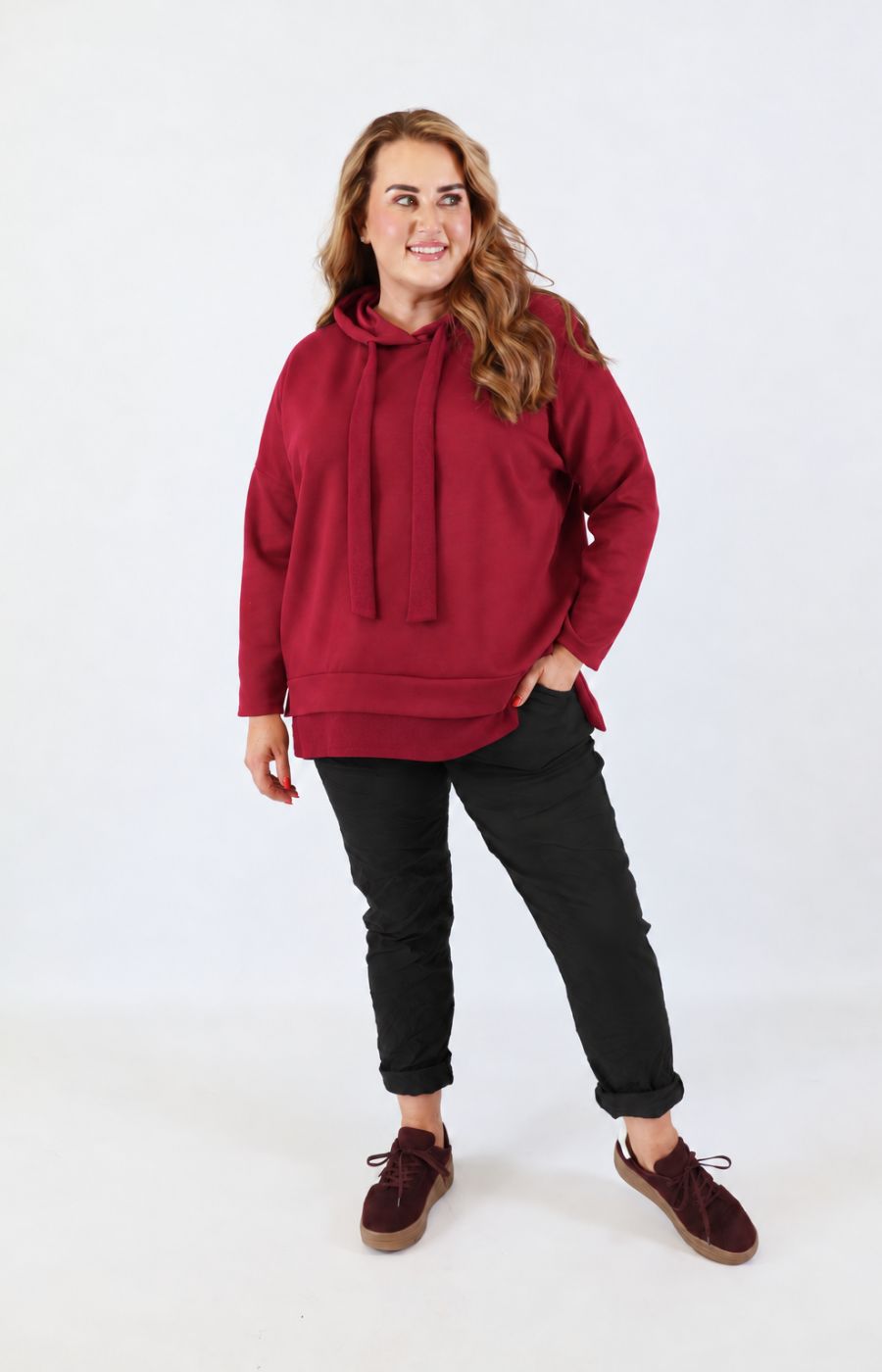 Change the colour of the top on the model, to the shade in the second image please, Change the trousers to brown please 
