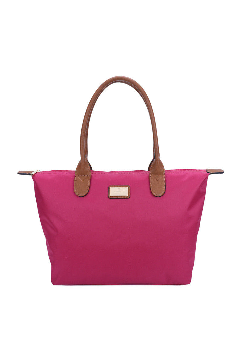 Pink handbag with brown handles on a white background 