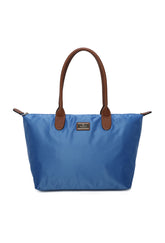 Blue tote bag with brown handles on a white background