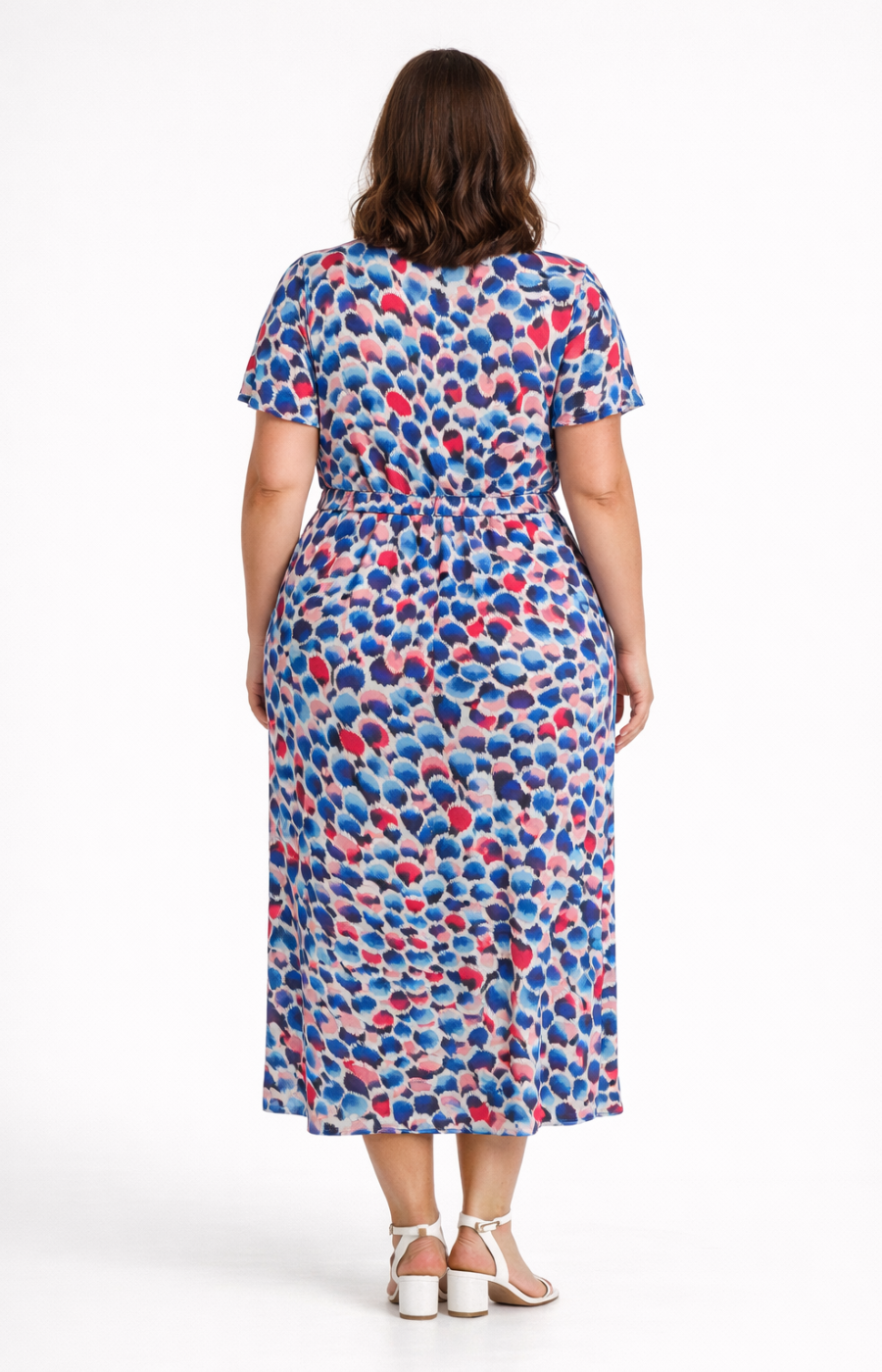 Woman wearing a colorful dress with a white background