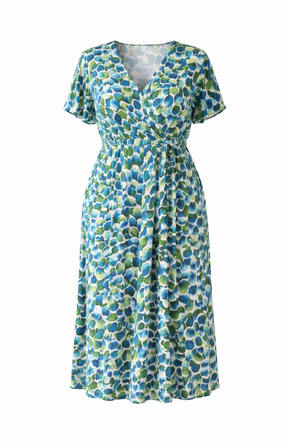Blue and green patterned dress on a white background