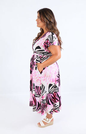 Dani Dress in Pink Palm Leaf. This image was created using AI 