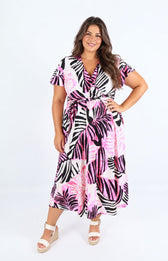 Dani Dress in Pink Palm Leaf. This image was created using AI
