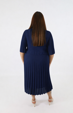 Woman wearing a navy blue dress on a white background