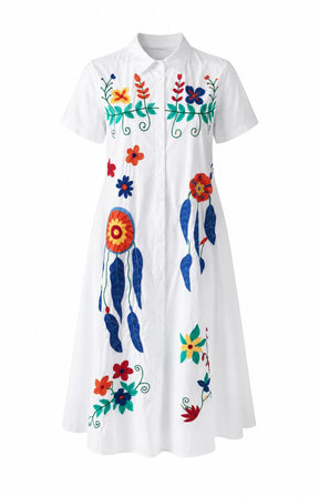 Fern Floral Dress in White, a white dress with colorful floral and abstract designs on a white background