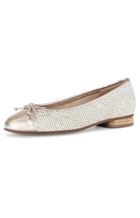 White and gold flat shoe on a white background