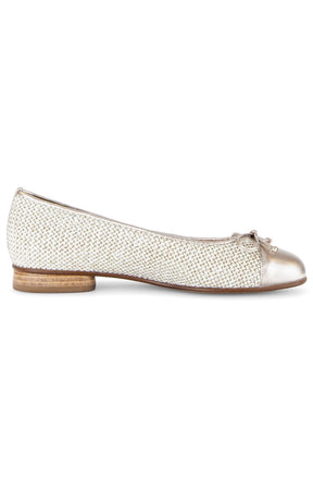 Gold ballerina shoe with a bow on a white background