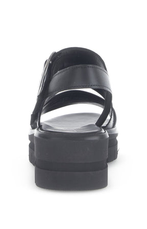 Gabor Platform Sandal in Black, a Black sandal with a metallic buckle on a white background  