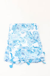 Blue and white paisley print scarf with tassels on a white background