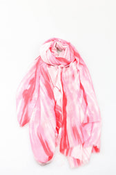 Pink and white tie-dye scarf on a white background