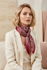 Jill Silk Scarf in Red. This image was created using AI.