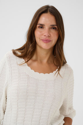Kaffe Curve Lotia Jumper in White, with a round, scalloped neckline and a design knitted into the material