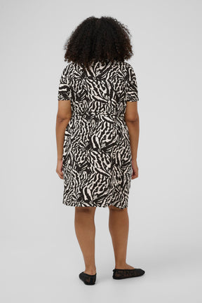 Knee length black and white animal print dress with short sleeves and a knee length