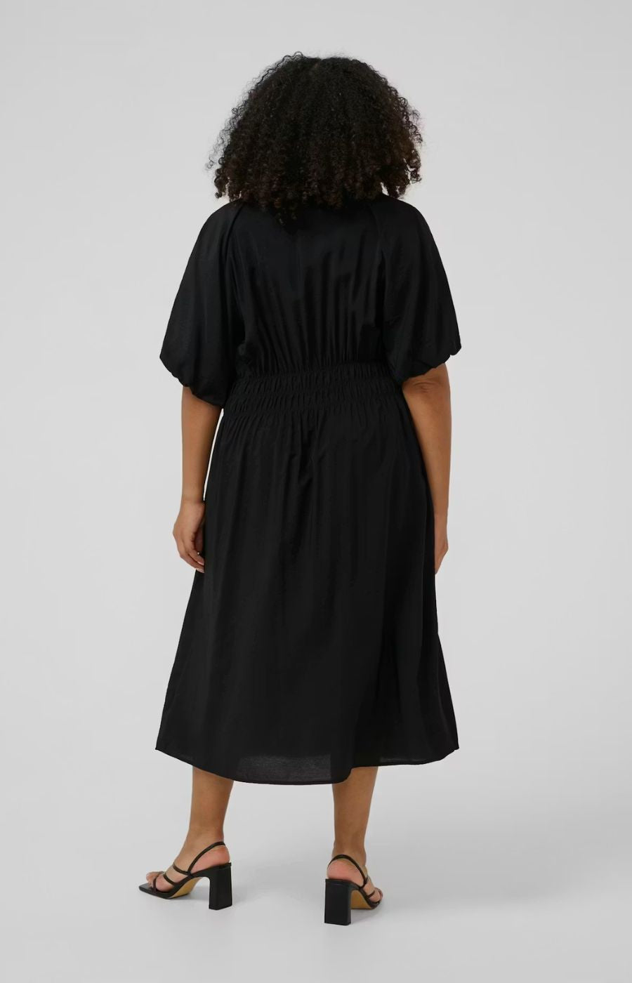 Kaffe Curve Neela Dress in Black, a midi length dress with waist elastication, 1/2 length sleeves