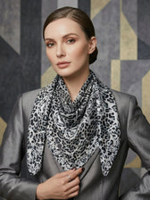 Lisa Leopard Print Silk Scarf in Grey. This image was created using AI