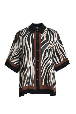 Mat Animal Print Shirt, a Zebra patterned shirt with black collar, button up front, 1/2 length sleeves and an oversized fit with side slits on a white background