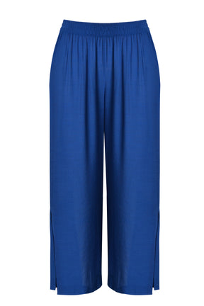 Mat Slit Trouser in Blue, ghost image, Front view, with an elasticated waistband, wide leg and side slits 