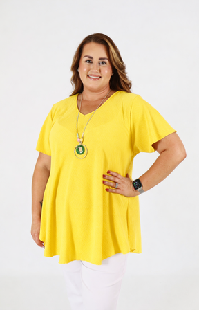 Woman wearing a yellow blouse on a white background