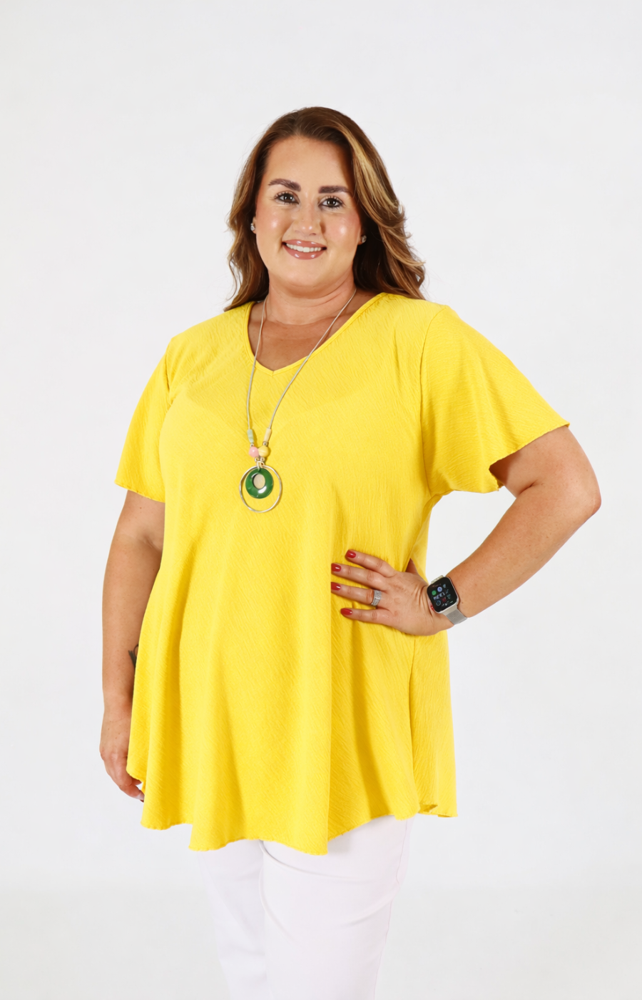 Woman wearing a yellow blouse on a white background