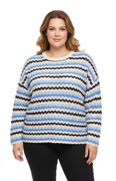 Plus size model shown front-on wearing a relaxed-fit blue and white striped long-sleeve knitted top.