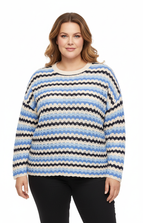 Plus size model shown front-on wearing a relaxed-fit blue and white striped long-sleeve knitted top.