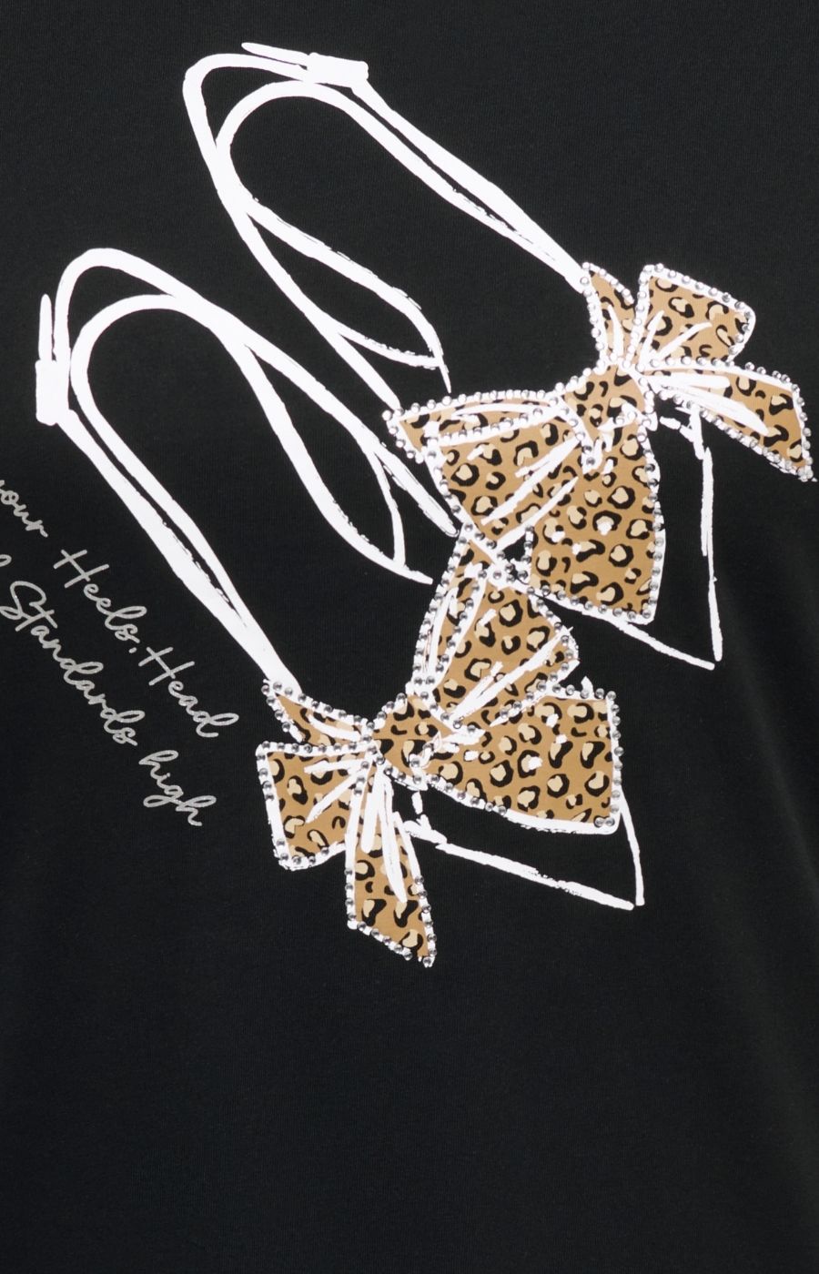 Close-up of the Only Carmakoma Beau T-Shirt in Black, a black t-shirt featuring a graphic print of two high heels decorated with leopard print bows and white outline details, alongside white script text. This image was created using AI.