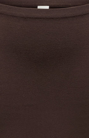 Close-up of the Only Carmakoma Ribi Skirt in Brown, a dark brown ribbed waist, knit skirt, showing the texture and colour.