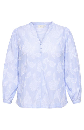 Light blue patterned blouse with a V neckline and long sleeves on a white background
