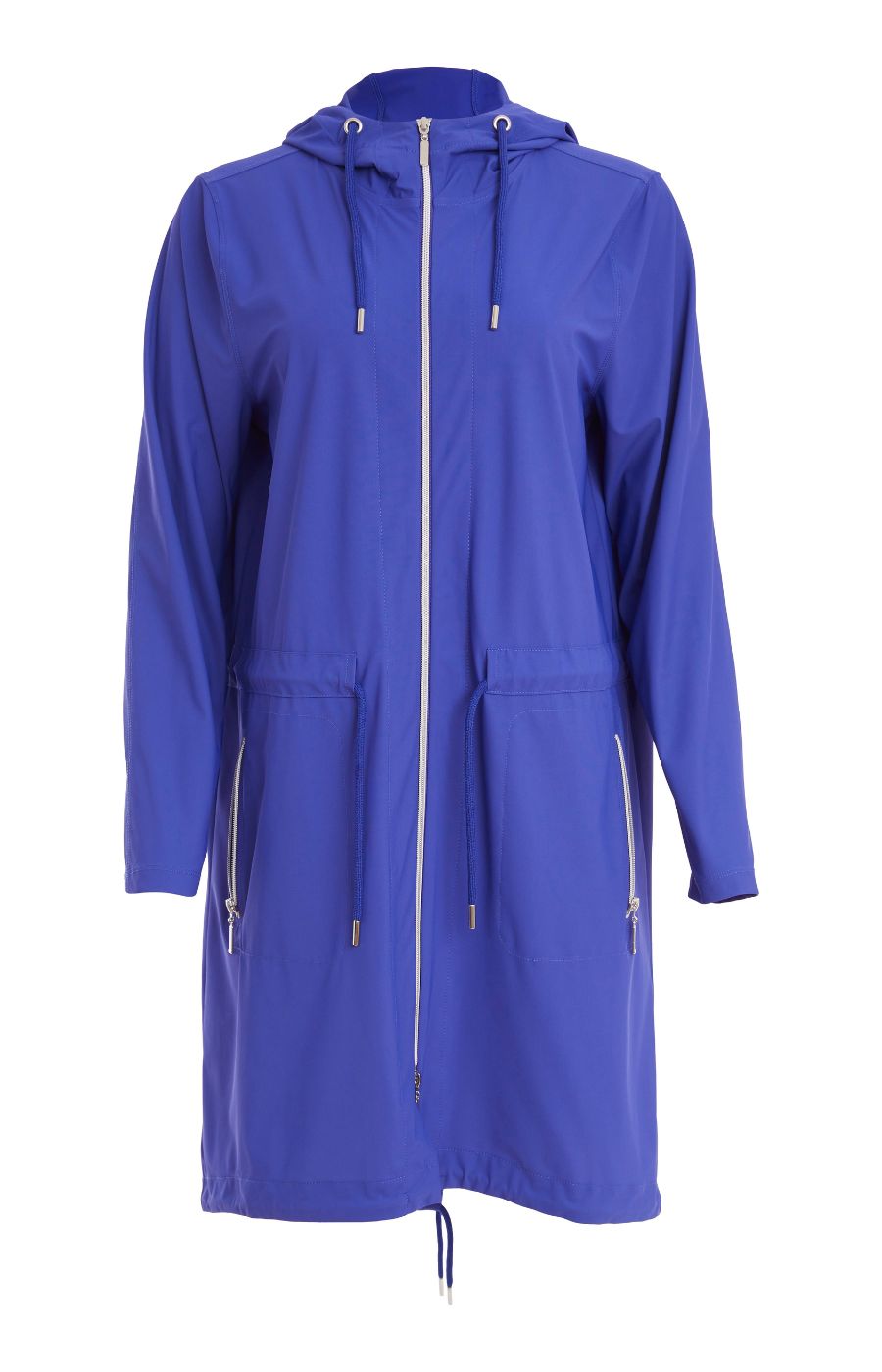 Woman wearing the Ora Hooded Jacket in Blue, with the blue Ora travel trousers a blue outfit with a white background  