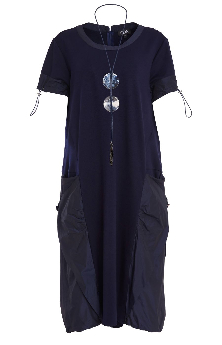 Woman wearing the Ora Side Pocket Dress in Navy, a navy blue dress with side pockets, round neckline and short sleeves, in a midi length.    