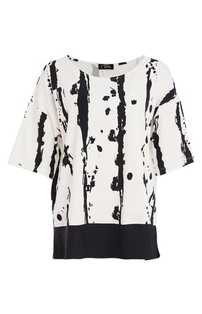 Woman wearing the Ora White and Black Stripe Top, a black and white messy stripe patterned top with 1/2 length sleeves, round neckline, relaxed fit and contrasting hem worn with black trousers.  