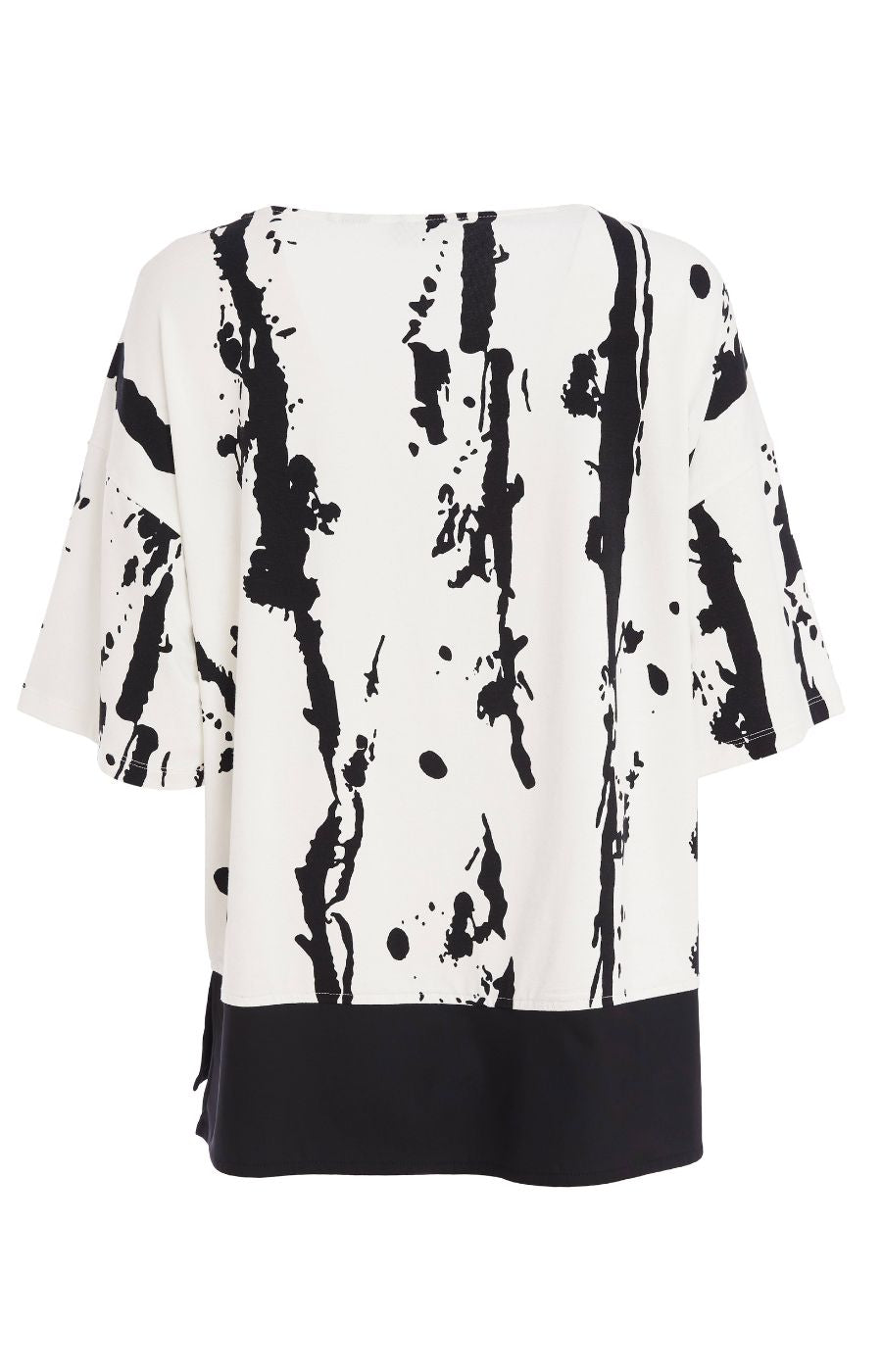 Woman wearing the Ora White and Black Stripe Top, a black and white messy stripe patterned top with 1/2 length sleeves, round neckline, relaxed fit and contrasting hem worn with black trousers.