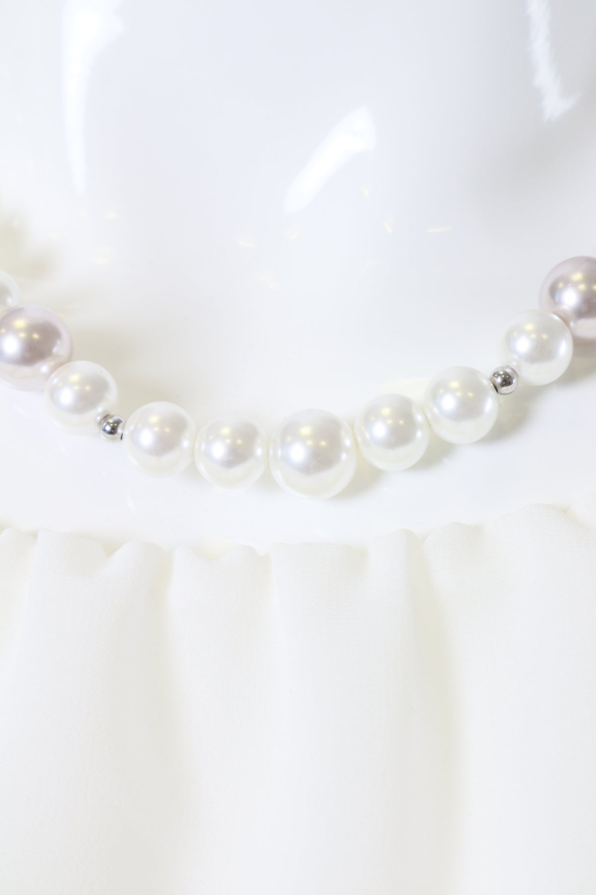 Pearl necklace on a white background