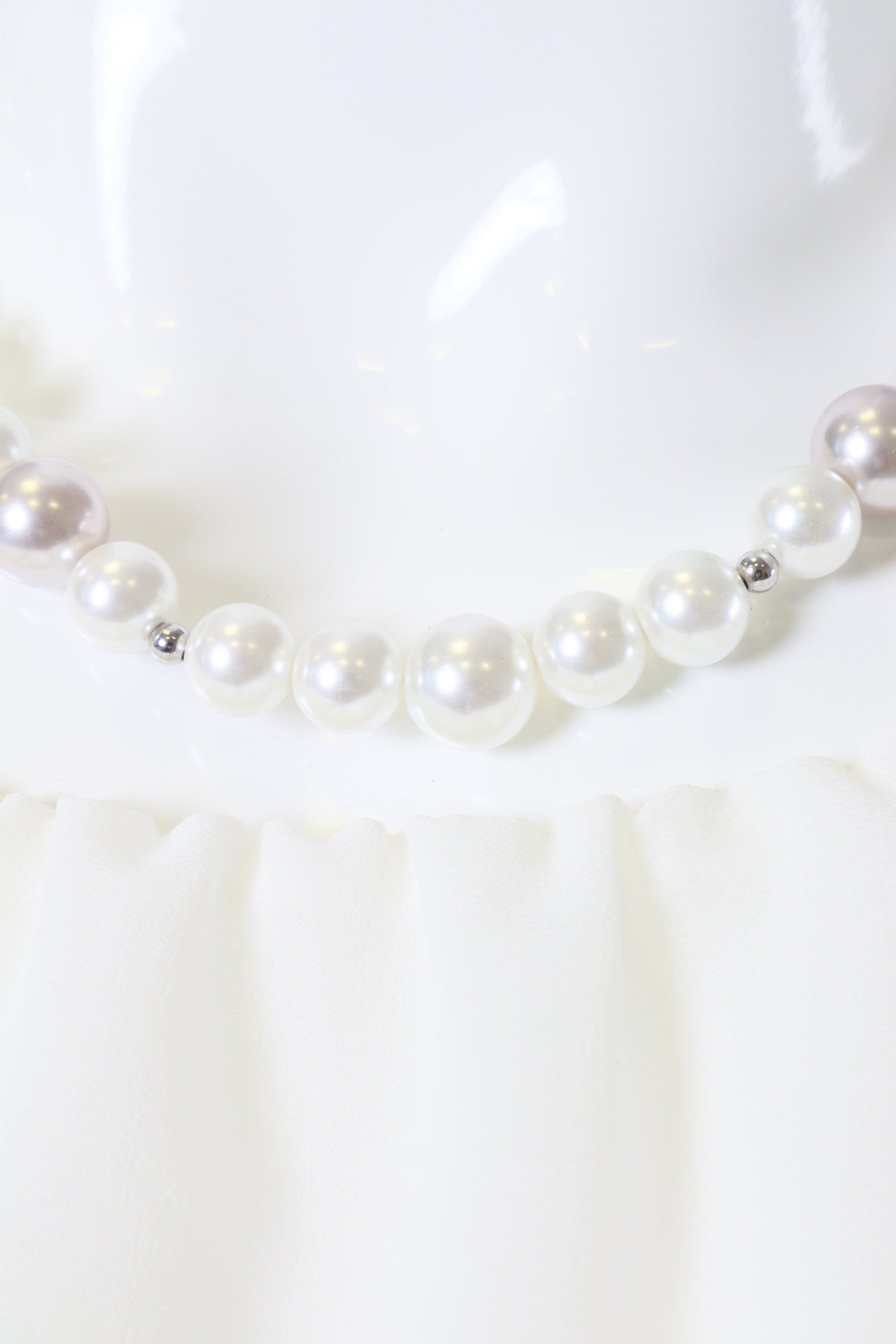 Pearl necklace on a white background
