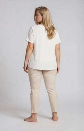 Woman wearing ther Robell Bella 09 Trousers in Beige Print on a plain background