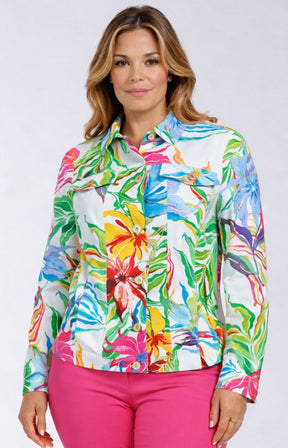 Woman wearing a colorful floral jacket with pink pants on a white background